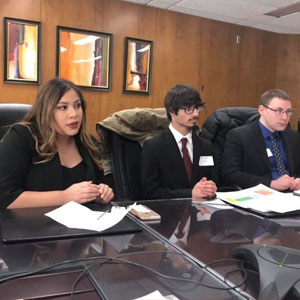 Youth leaders Kimberly, Roman, and Michael brief officials at the U.S. Department of Housing and Urban Development March 5, 2019.
